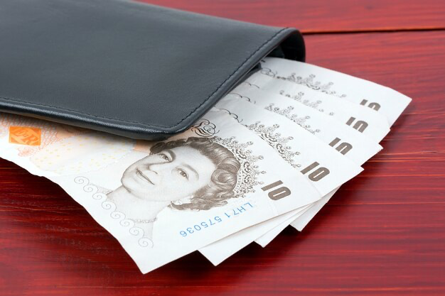 British pounds in a black wallet
