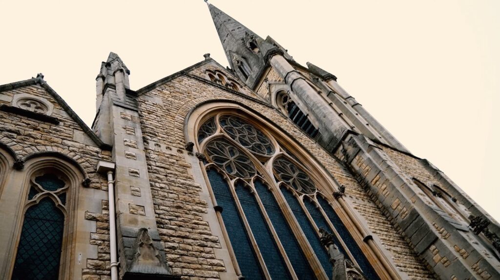 The gothic facade of a historic church with a large rose window